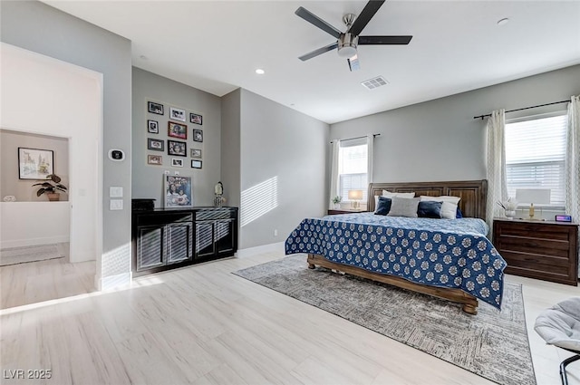 bedroom with wood finished floors, visible vents, recessed lighting, ceiling fan, and baseboards