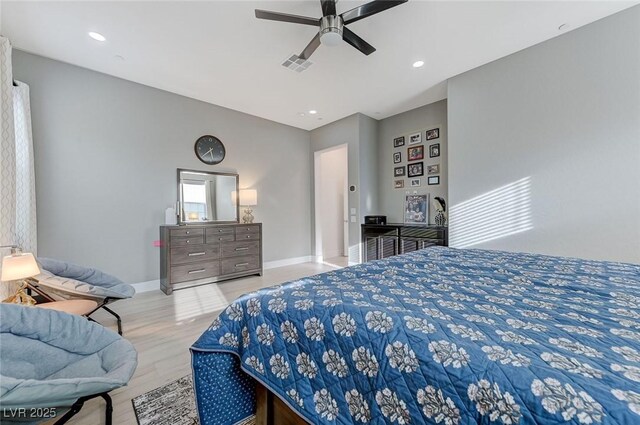 bedroom with wood finished floors, visible vents, recessed lighting, ceiling fan, and baseboards