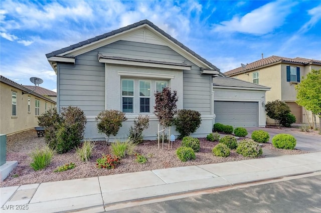 view of front of property featuring driveway and a garage