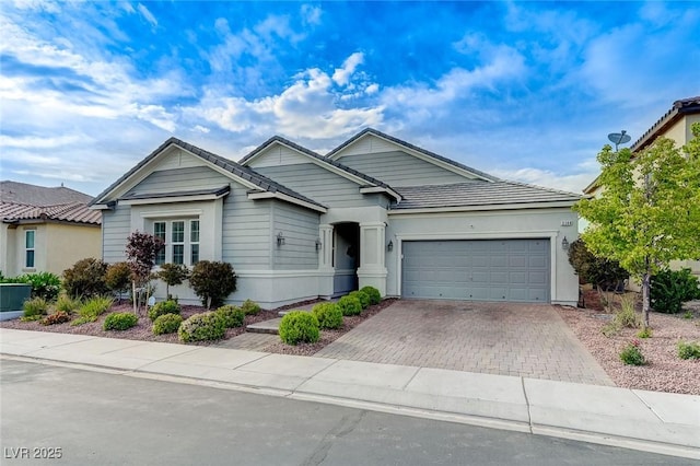 view of front of property featuring driveway and a garage