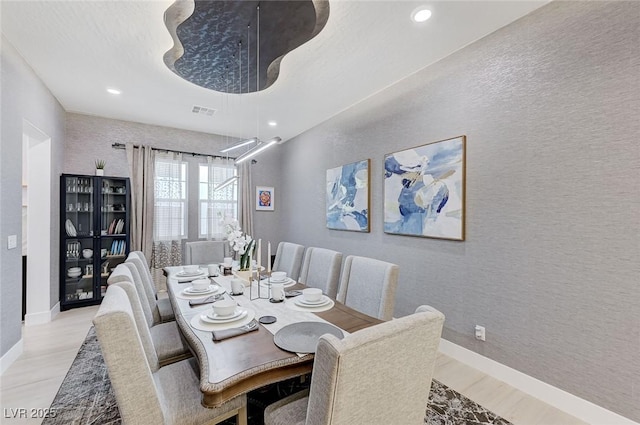 dining room featuring recessed lighting, light wood-style floors, and visible vents