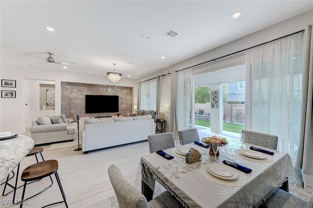dining room with a ceiling fan, recessed lighting, and visible vents