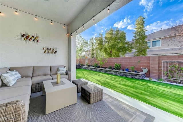view of patio featuring an outdoor hangout area and a fenced backyard