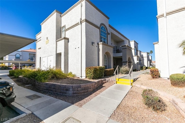 3150 Soft Breezes Dr Unit 2030, Las Vegas, NV 89128 - view of home's exterior featuring stucco siding and a residential view
