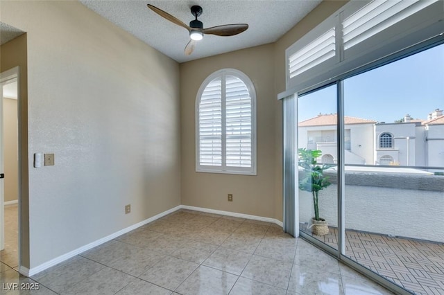 3150 Soft Breezes Dr Unit 2030, Las Vegas, NV 89128 - spare room featuring a ceiling fan, tile patterned flooring, a textured ceiling, and baseboards