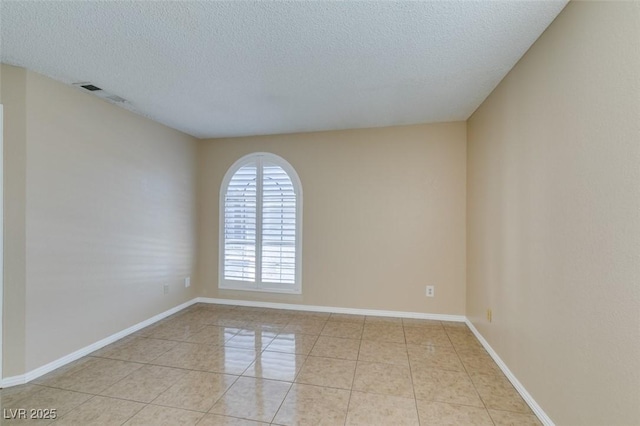 3150 Soft Breezes Dr Unit 2030, Las Vegas, NV 89128 - empty room with a textured ceiling, baseboards, light tile patterned floors, and visible vents