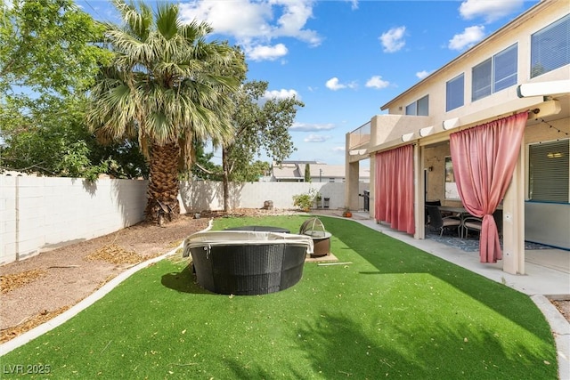 view of yard with a patio area and a fenced backyard