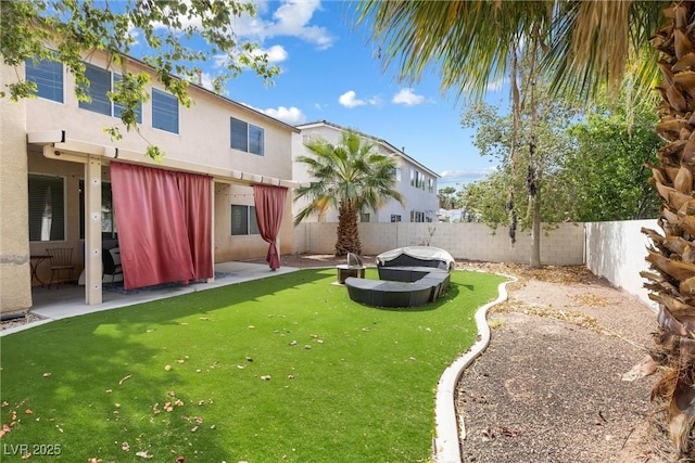 view of yard featuring a fenced backyard and a patio