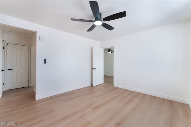 empty room with light wood-style floors, baseboards, and ceiling fan