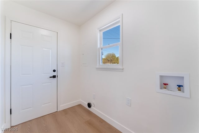 laundry area featuring laundry area, light wood-type flooring, baseboards, and hookup for a washing machine