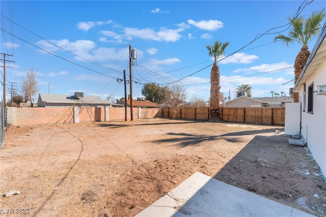 view of yard with a fenced backyard