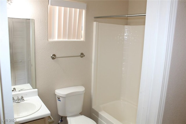 full bath with a closet, toilet, and vanity