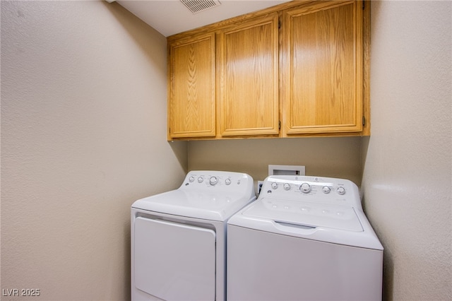 6274 Elderberry Wine Ave, Las Vegas, NV 89142 - laundry area featuring cabinet space, washing machine and dryer, and visible vents