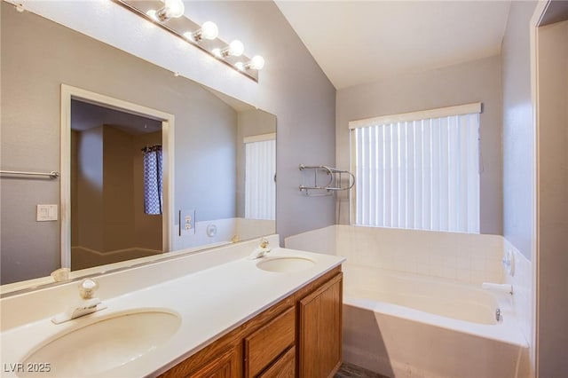 6274 Elderberry Wine Ave, Las Vegas, NV 89142 - bathroom with a sink, double vanity, and a bath