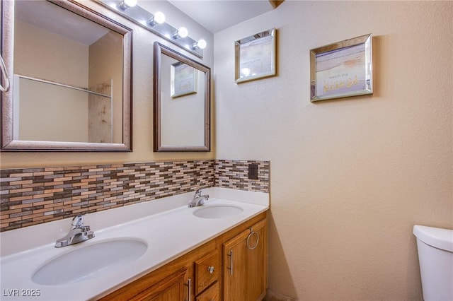 6274 Elderberry Wine Ave, Las Vegas, NV 89142 - full bath featuring toilet, decorative backsplash, double vanity, and a sink