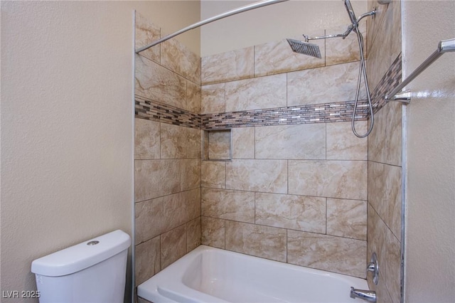 6274 Elderberry Wine Ave, Las Vegas, NV 89142 - bathroom featuring bathing tub / shower combination, toilet, and a textured wall