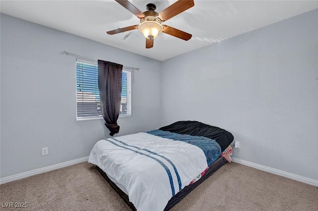 bedroom featuring carpet floors, baseboards, and ceiling fan