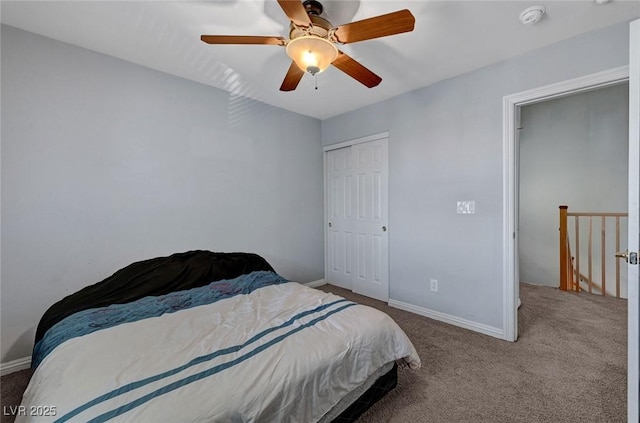 bedroom with carpet floors, baseboards, a closet, and a ceiling fan