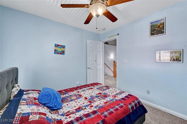 bedroom featuring light carpet, baseboards, and a ceiling fan