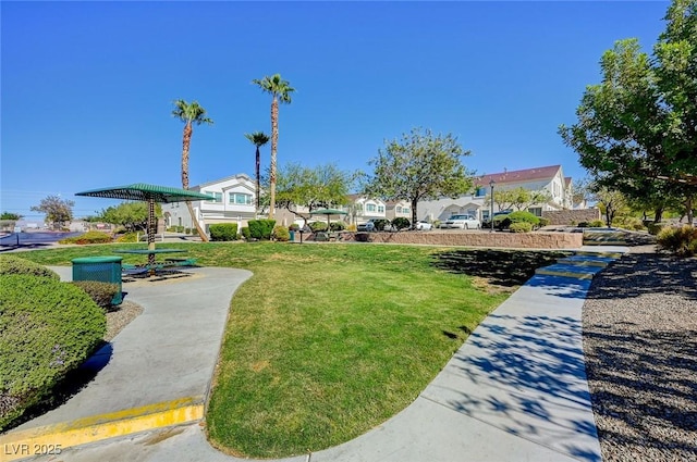 view of home's community featuring a yard and a residential view