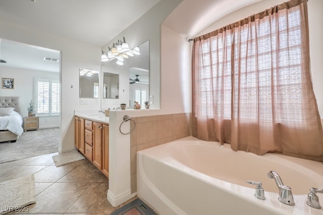 10294 Running Falls St, Las Vegas, NV 89178 - ensuite bathroom featuring vanity, a bath, a ceiling fan, and tile patterned flooring