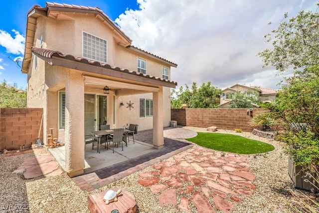 10294 Running Falls St, Las Vegas, NV 89178 - rear view of property featuring stucco siding, a fenced backyard, and a patio