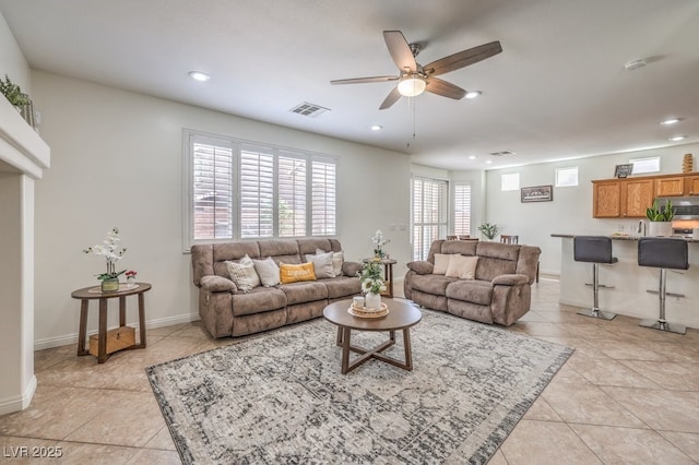10294 Running Falls St, Las Vegas, NV 89178 - living area featuring a ceiling fan, recessed lighting, light tile patterned floors, and baseboards