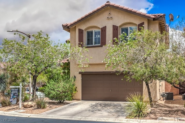 10294 Running Falls St, Las Vegas, NV 89178 - mediterranean / spanish-style house featuring stucco siding, central air condition unit, a tile roof, and driveway