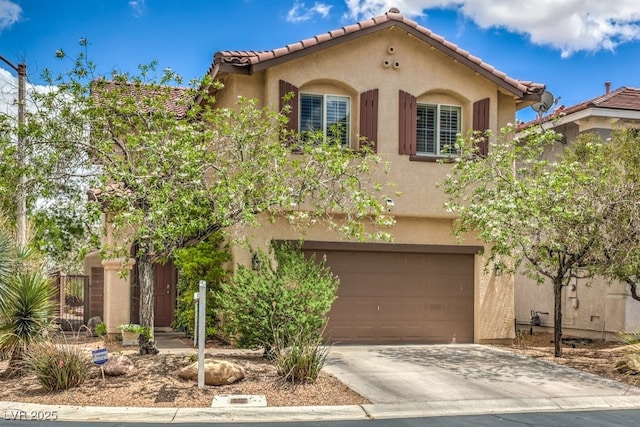 10294 Running Falls St, Las Vegas, NV 89178 - mediterranean / spanish house with stucco siding, driveway, an attached garage, and a tiled roof