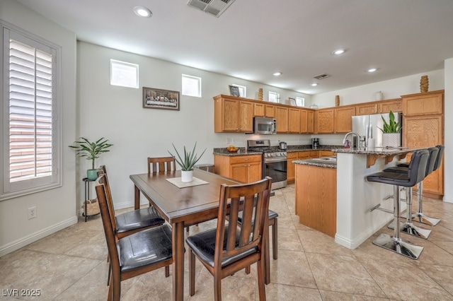 10294 Running Falls St, Las Vegas, NV 89178 - dining area with recessed lighting, baseboards, and light tile patterned flooring