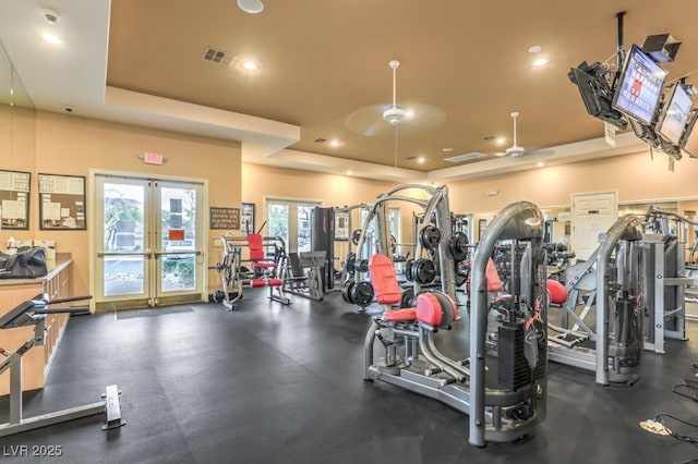10294 Running Falls St, Las Vegas, NV 89178 - exercise room featuring a raised ceiling, french doors, a ceiling fan, and recessed lighting