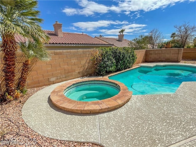 8940 Emery Lake St, Las Vegas, NV 89123 - view of pool with a fenced backyard and a pool with connected hot tub