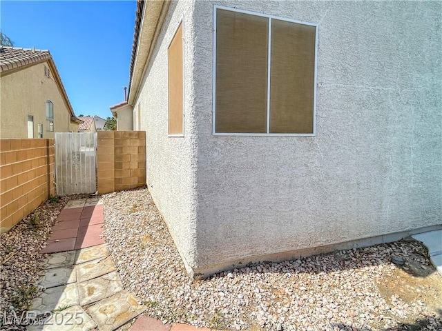 8940 Emery Lake St, Las Vegas, NV 89123 - view of side of home featuring stucco siding