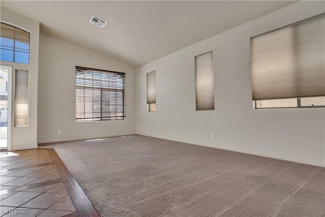 8940 Emery Lake St, Las Vegas, NV 89123 - carpeted spare room with lofted ceiling, inlaid floor details, and baseboards