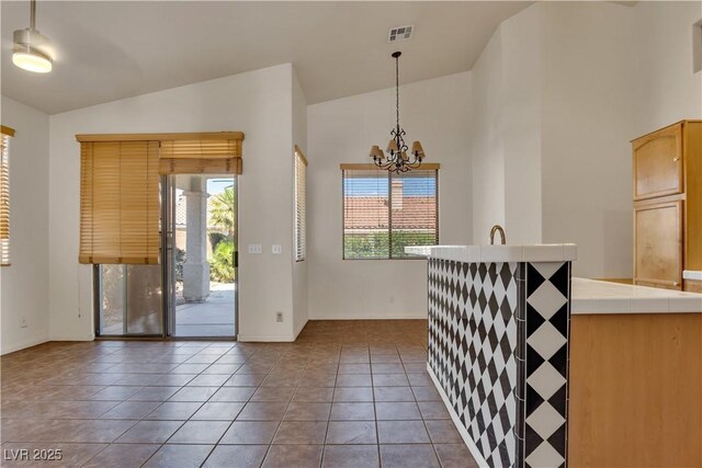 8940 Emery Lake St, Las Vegas, NV 89123 - tiled foyer featuring baseboards, a chandelier, and high vaulted ceiling