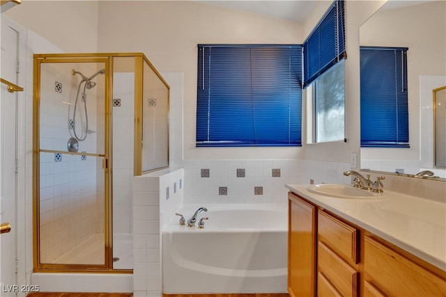 8940 Emery Lake St, Las Vegas, NV 89123 - full bathroom featuring a stall shower, a garden tub, vanity, and vaulted ceiling