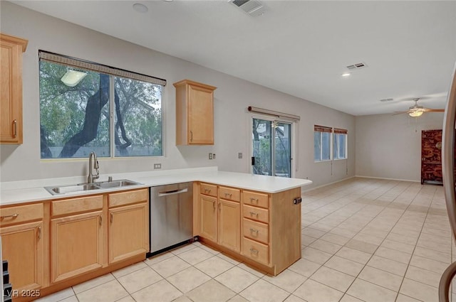 kitchen featuring stainless steel dishwasher, a sink, a peninsula, ceiling fan, and light brown cabinets