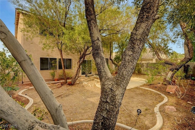 fenced backyard with a patio area