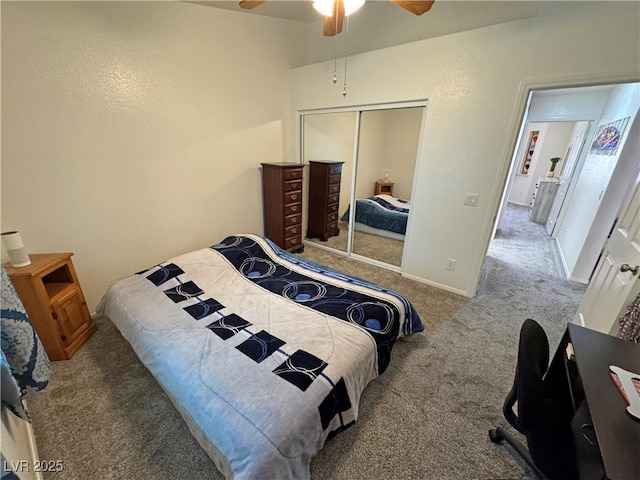carpeted bedroom with a closet, a ceiling fan, and baseboards