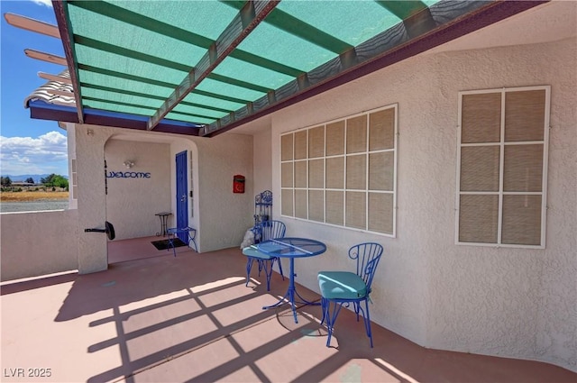 view of patio featuring a pergola