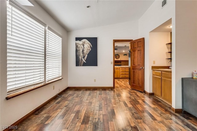 5242 Dickens Dr, Las Vegas, NV 89119 - interior space with baseboards, dark wood-style flooring, visible vents, and vaulted ceiling