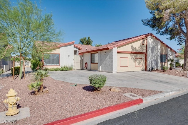5242 Dickens Dr, Las Vegas, NV 89119 - mediterranean / spanish house featuring stucco siding and a tile roof