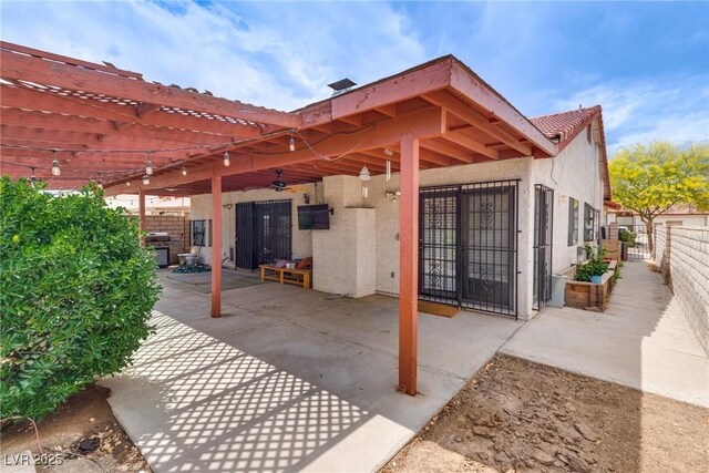 5242 Dickens Dr, Las Vegas, NV 89119 - view of patio with a grill, a pergola, and a fenced backyard