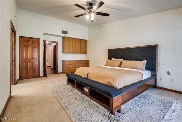 5242 Dickens Dr, Las Vegas, NV 89119 - bedroom featuring light colored carpet, baseboards, a ceiling fan, and visible vents