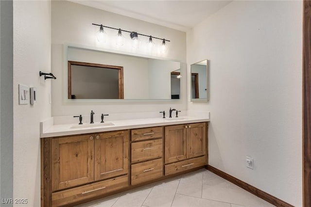 5242 Dickens Dr, Las Vegas, NV 89119 - bathroom featuring baseboards, tile patterned floors, double vanity, and a sink