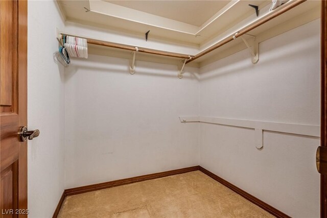 5242 Dickens Dr, Las Vegas, NV 89119 - spacious closet with light colored carpet
