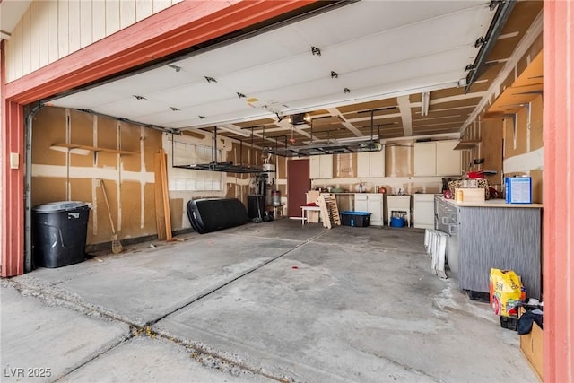 5242 Dickens Dr, Las Vegas, NV 89119 - garage with washer / dryer and a sink