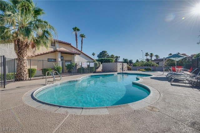 5242 Dickens Dr, Las Vegas, NV 89119 - community pool featuring fence and a patio