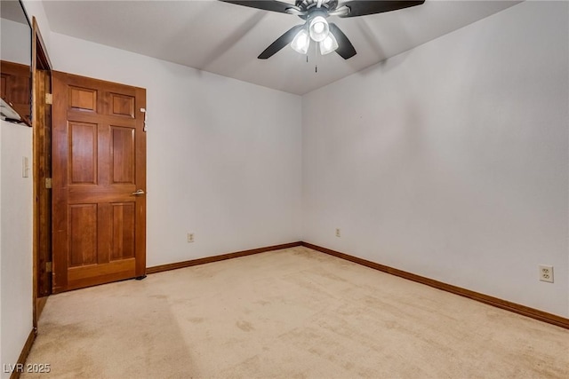 5242 Dickens Dr, Las Vegas, NV 89119 - unfurnished room with light colored carpet, baseboards, and a ceiling fan
