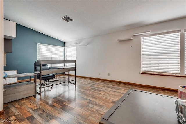 5242 Dickens Dr, Las Vegas, NV 89119 - home office with baseboards, visible vents, wood finished floors, and lofted ceiling